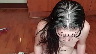 A young woman humiliates herself by writing on her body with urine and eats fruits that have been touched by the same liquid