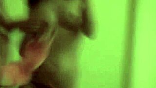 Two teenage red-haired girls play with a camera in the bedroom