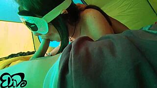 This beautiful woman with small breasts gives a deep blow job in the tent
