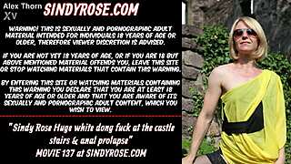 Sindy Rose fucks huge white dong on castle stairs with anal prolapse