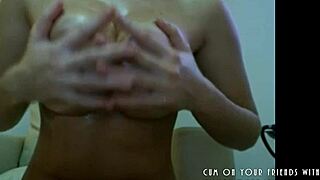 Beautiful amateur with big boobs gets oiled and shows off her body on webcam