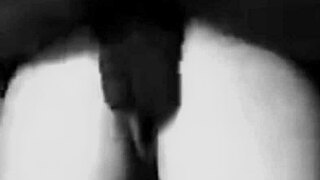 Petite Caucasian woman handles a massive black shaft