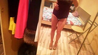Seductive striptease performance revealing breasts and buttocks