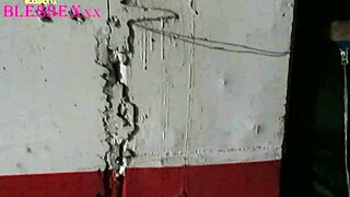 A masked stranger has sex with Livia in a garage.