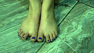 Close up of a cute girl’s feet and toes in the bedroom.