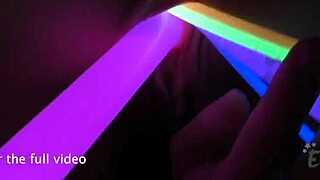 Pretty 27-year-old Raquel with a kinky smile and a tattooed body opens her vagina with glowsticks to show her cervix.