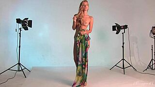 Naked blonde teen with sexy glasses in dress for sensual scene