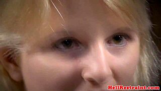A BDSM scene with a kinky punishment where the submissive is chained and whipped