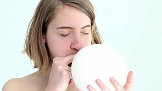 Young and straight forward, a looner babe’s first balloon popping experience