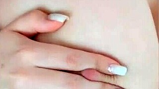 Petite teen's big nipples get stimulated on camera solo