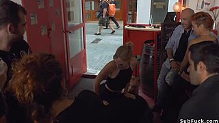 Small blonde tied up and double penetrated in a bar in public