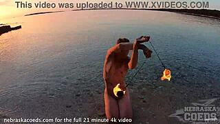 Beautiful woman dancing with fire on the beach at sunset