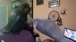 Naejae sits alone, rubbing her wet twat while watching hot lesbian porn on her screen.