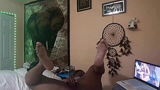 Naejae sits alone, rubbing her wet twat while watching hot lesbian porn on her screen.