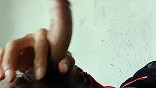 Young gay guy showing off his big cock in a solo video