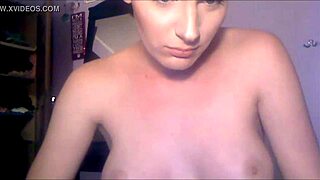 Stunning shemale with short hair performs on webcam, showcasing her transsexual beauty.