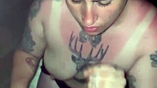 Sunburned blonde goddess with tattoos gives deepthroat blowjob in thong