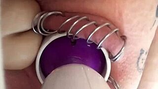 This horny babe works her pierced pussy with toys.