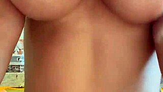 Monika Fox strips to masturbate with pierced nipples in bathroom