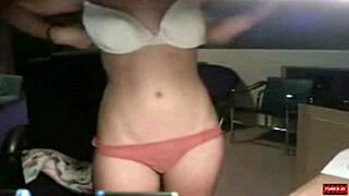 A young webcam girl teases in a solo masturbation session