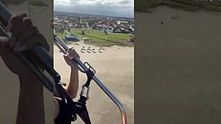 Priscila belini flies naked on paramotor and masturbates in the air.