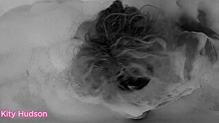 Curvy mature Kitty Hudson bathes with vibrator for orgasm