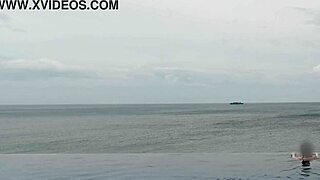 skinny student with cute legs relaxes by the infinity pool