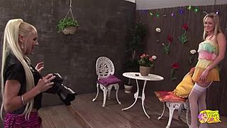 Two lesbians in stockings play sexy games under camera