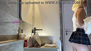 Beautiful cheerleader flashes panties in bathroom