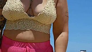 african woman flashes big pussy lips to excite her beach lover