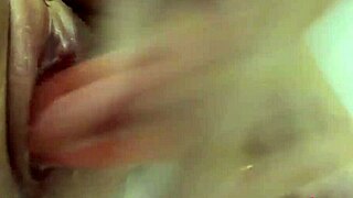 beautiful girl plays with pussy dildo in shower