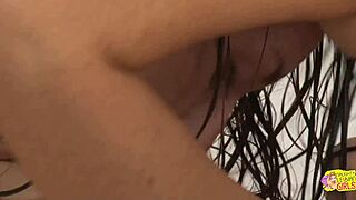 Two brunette lesbians lick and kiss in shower before sex