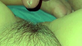 Asian girl at home masturbates her big wet pussy, wondering how it fits a cock.