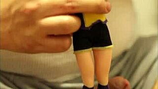 batgirl doll from dc comics is tied up and gets showered in sticky substance