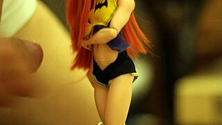 batgirl doll from dc comics is tied up and gets showered in sticky substance