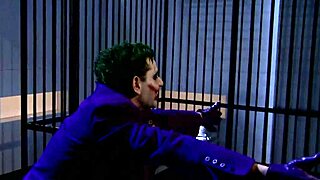 Katwoman Jennifer Dark prowls into prison cage for 3way with big tits blowjob and muff diving action.