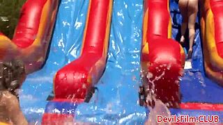 Lesbian beauties toying each other's pussies with strapon dildos outdoors. Dive into intense muff diving and licking!