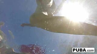 Olivia enjoys a relaxing summer day splashing around in the sunny pool