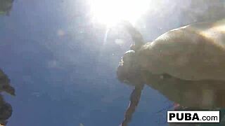 Olivia enjoys a relaxing summer day splashing around in the sunny pool