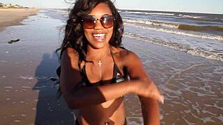Getting naked at the beach with big ass black ebony elegance dancing in outdoor public setting.