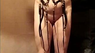 French housewife slave performs outdoor public exhibition with bondage and dildo masturbation in leather harness as humiliated maid