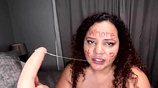 i'm a bbw colored girl deepthroating this dildo after scribbling dirty words on my slutty whore face
