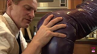 Hey, that slutty redhead takes a monster cock deep in her pierced pussy right in the kitchen