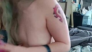 Blonde milf with big tits and tattoo teases her big ass using dildo for anal training in horny solo session