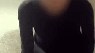 The amateur Japanese teen poses in red sexy shorts and see-through lingerie for a softcore shoot.