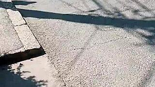 She flashes her ass publicly on the street. Milf goes fully naked outdoors in this scene.