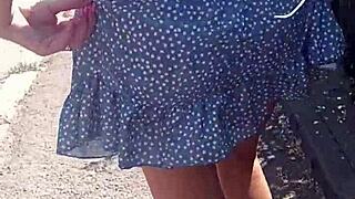 She flashes her ass publicly on the street. Milf goes fully naked outdoors in this scene.