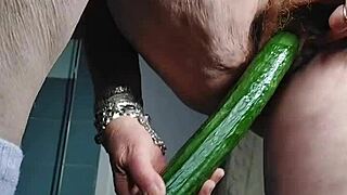 Grandma stuffs her hairy beaver with a big cucumber in wild German solo action.