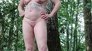 Milf slave flashes tits outdoors then bends for humiliating forest doggystyle session