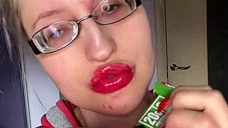 giantess with huge lips n glasses smears snickers bar... mmm so messy!